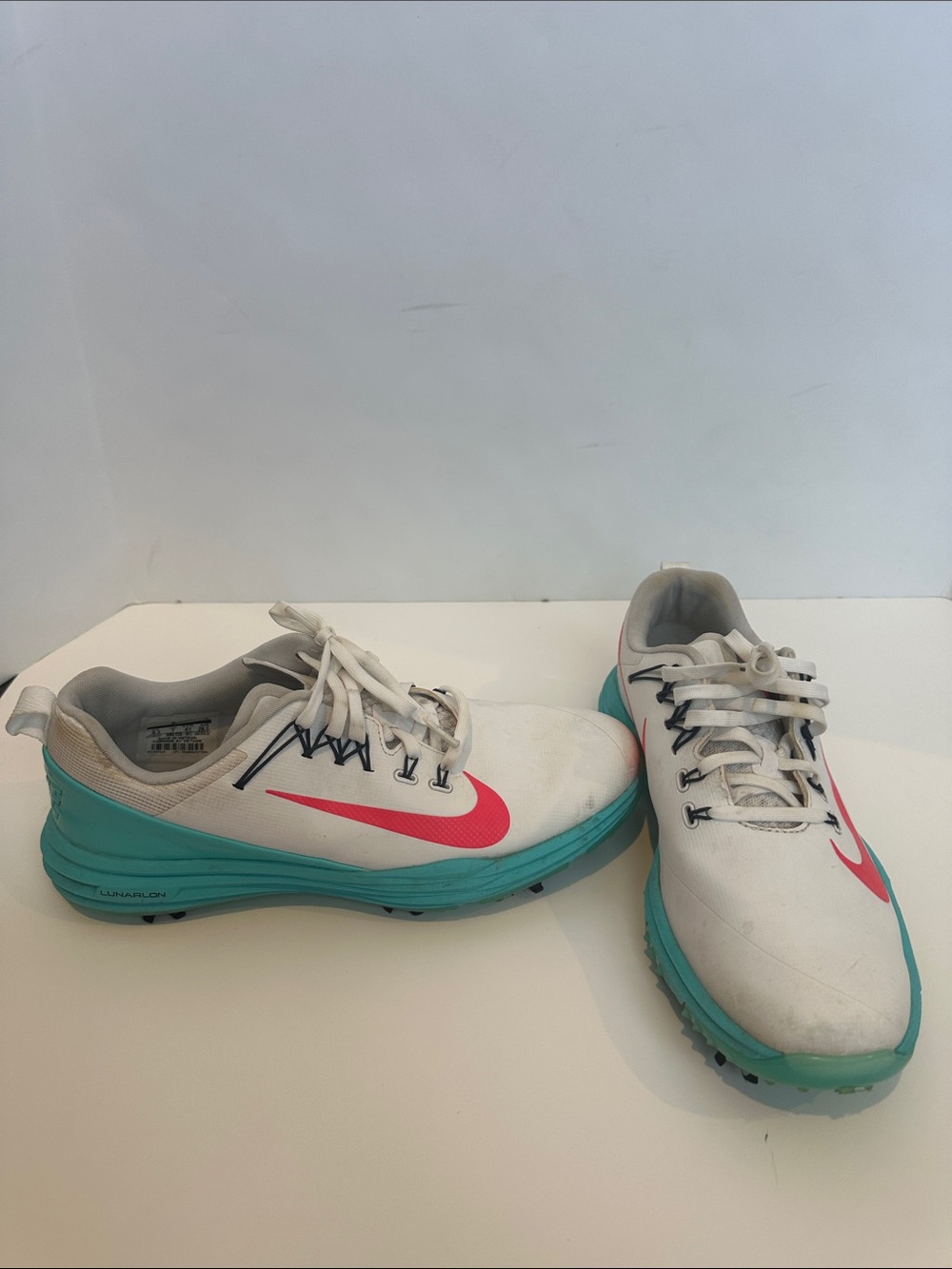 Nike White golf shoes with Teal Sole and Pink Swoosh